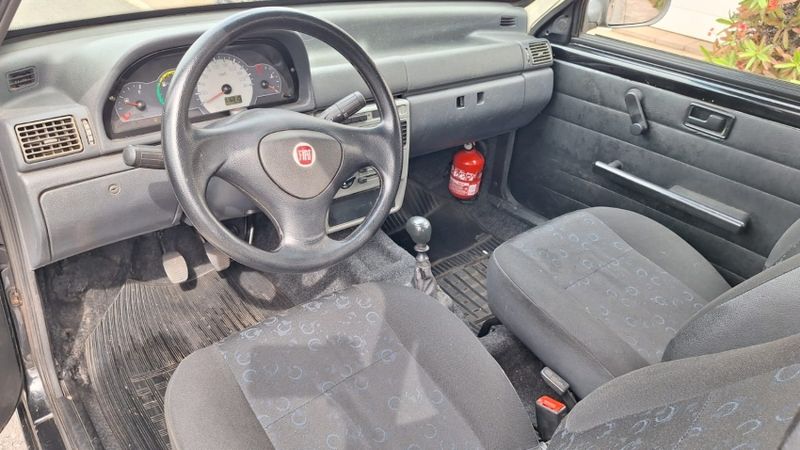 Fiat UNO 1.0 MPI MILLE FIRE ECONOMY 8V FLEX 2P MANUAL 2013/2013 CAMINHÕES & CAMIONETAS PASSO FUNDO / Carros no Vale