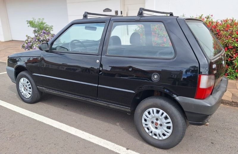 Fiat UNO 1.0 MPI MILLE FIRE ECONOMY 8V FLEX 2P MANUAL 2013/2013 CAMINHÕES & CAMIONETAS PASSO FUNDO / Carros no Vale